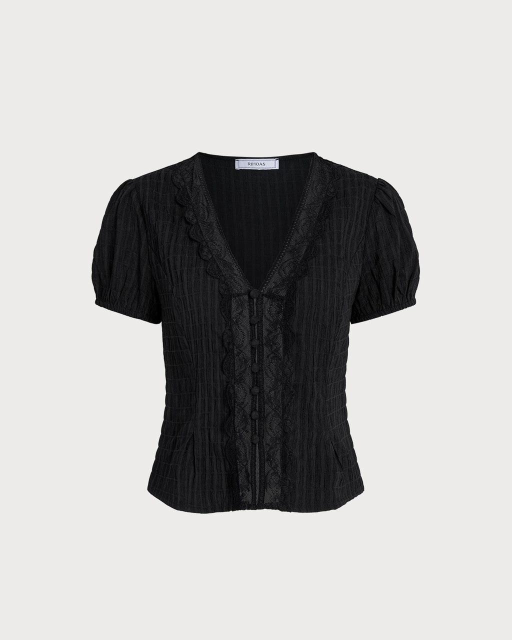 Blusa negra jacquard con encaje
