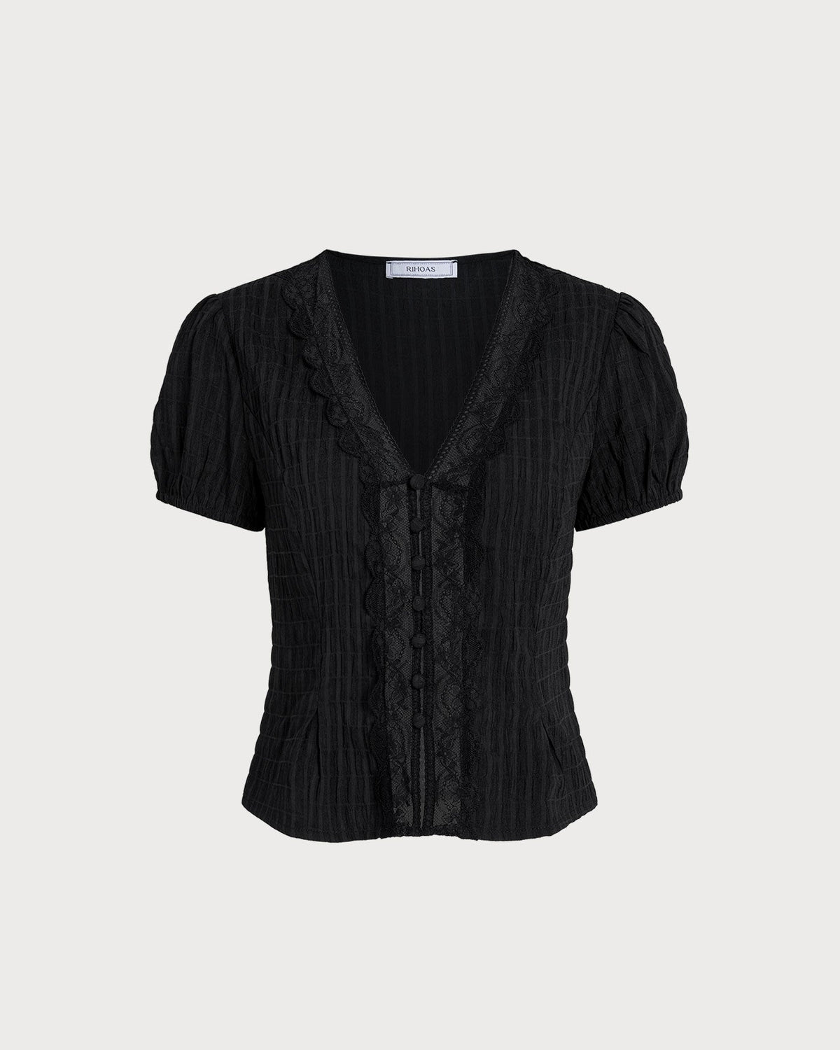 Blusa negra jacquard con encaje