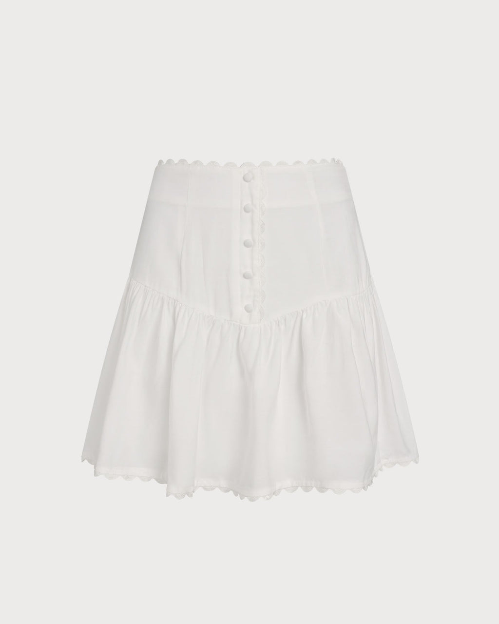 Falda mini blanca elegante fruncida con botones delanteros
