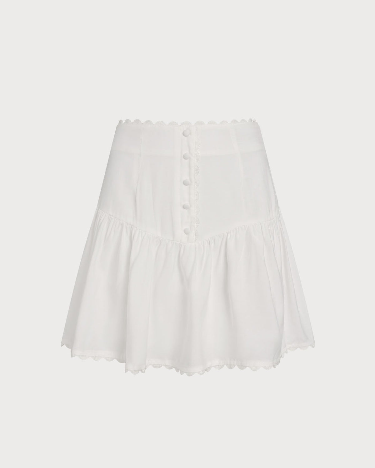 Falda mini blanca elegante fruncida con botones delanteros