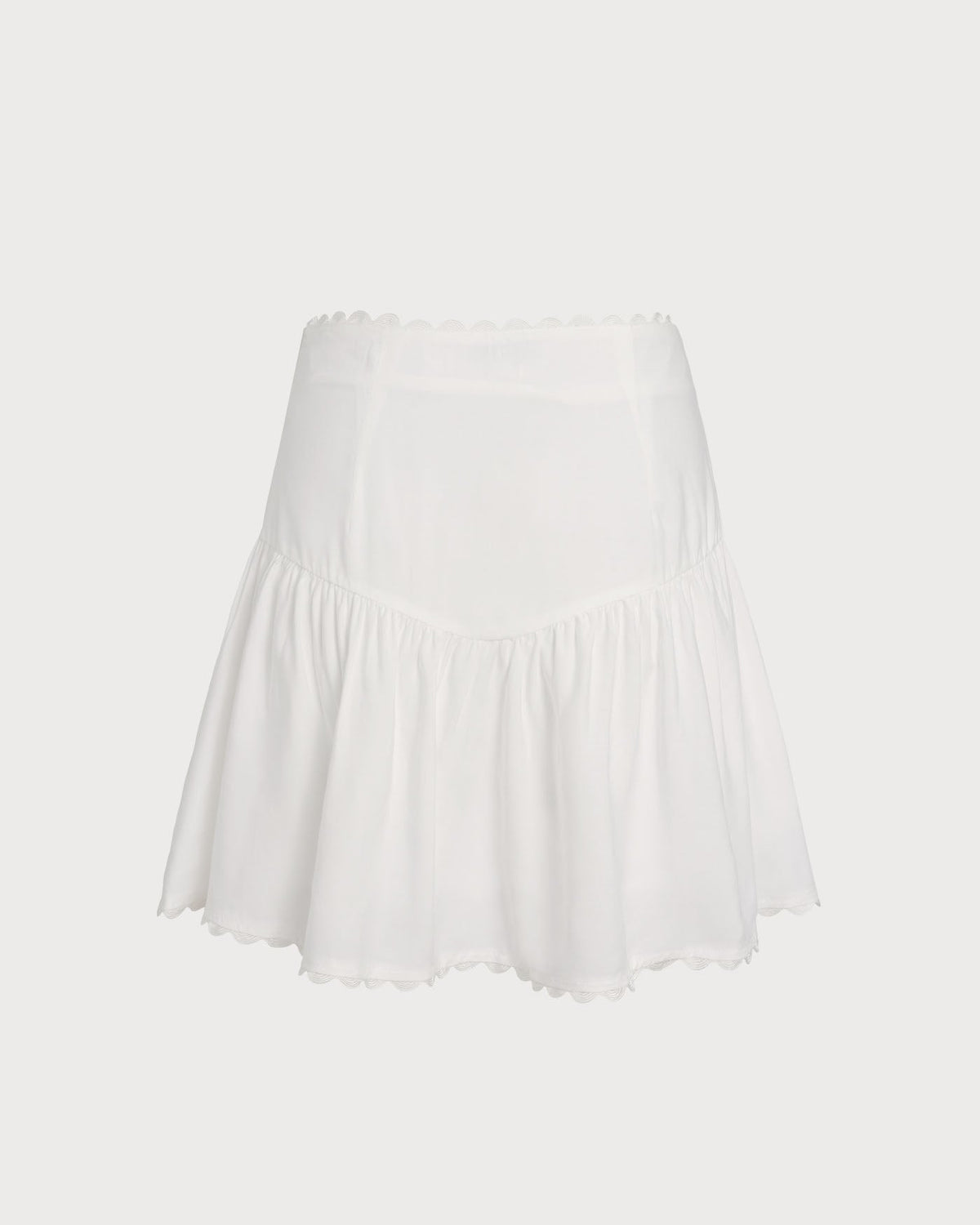 Falda mini blanca elegante fruncida con botones delanteros