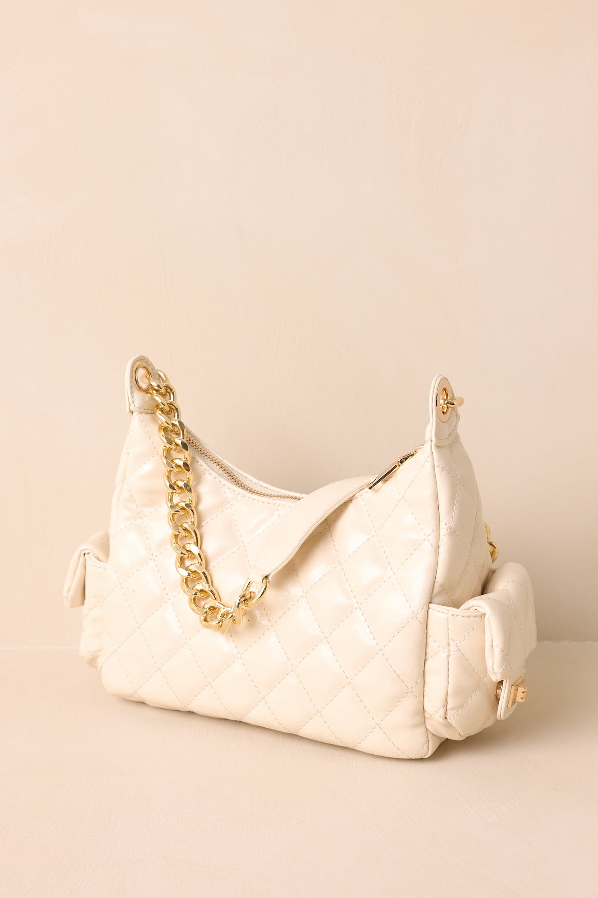 Bolso elegante de piel acolchada color marfil