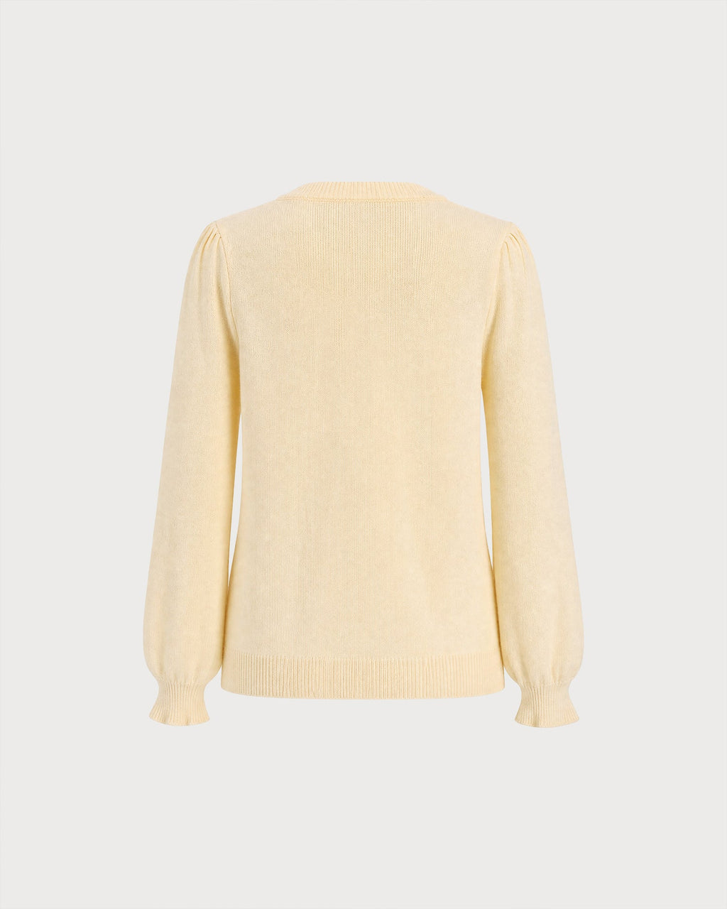 Cárdigan de punto amarillo con cuello redondo y largo hasta la cadera