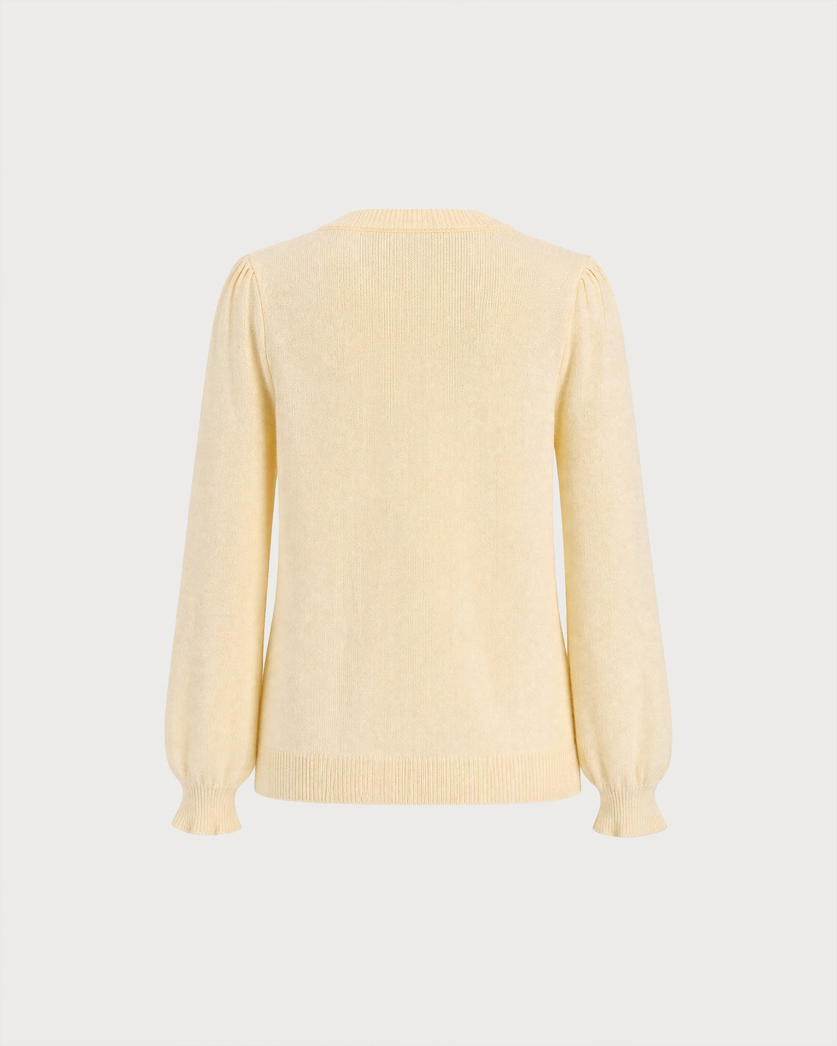 Cárdigan de punto amarillo con cuello redondo y largo hasta la cadera