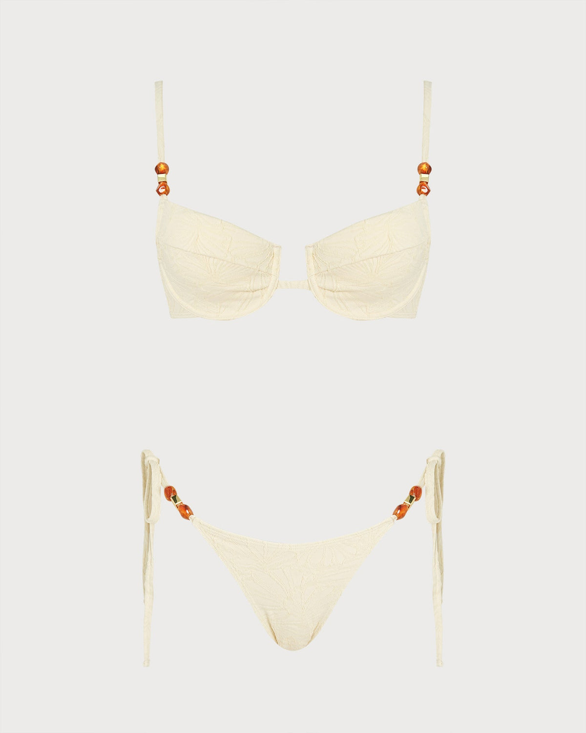 Conjunto de bikini color albaricoque con tirantes de lazo y adornos de pedrería