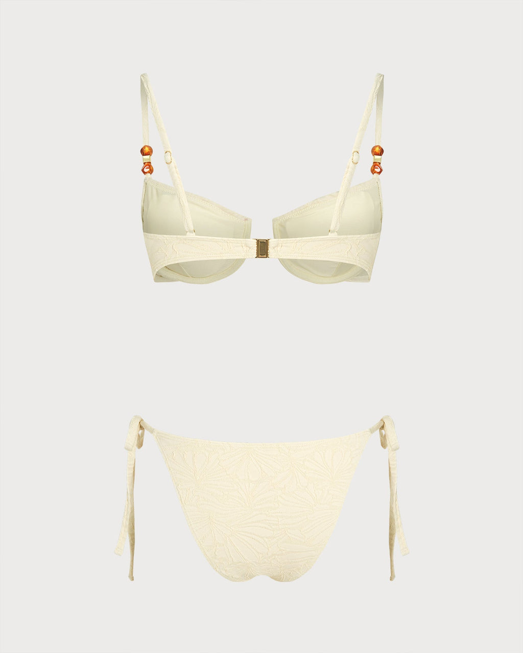 Conjunto de bikini color albaricoque con tirantes de lazo y adornos de pedrería