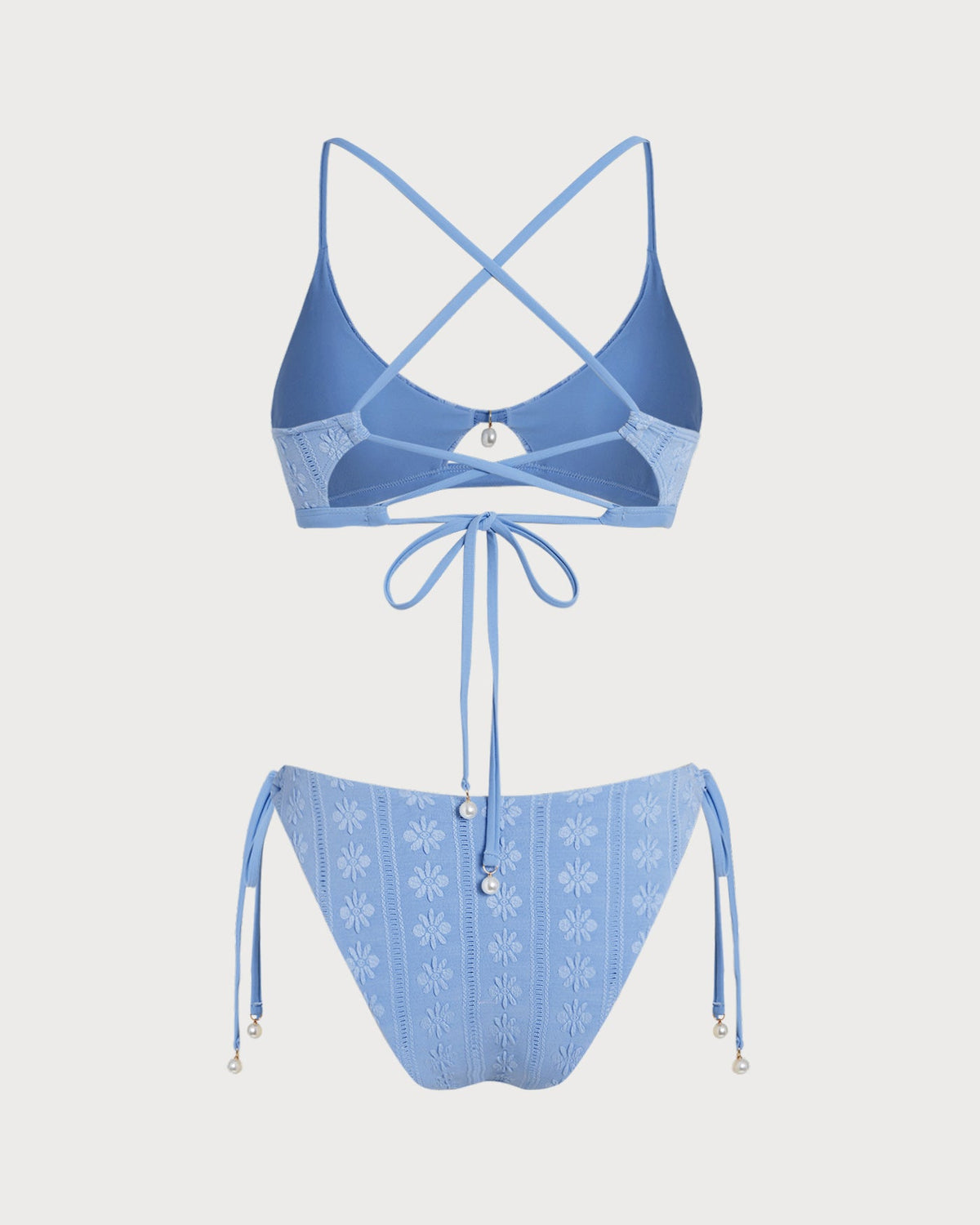 Conjunto de bikini triangular azul con estampado floral y escote en U