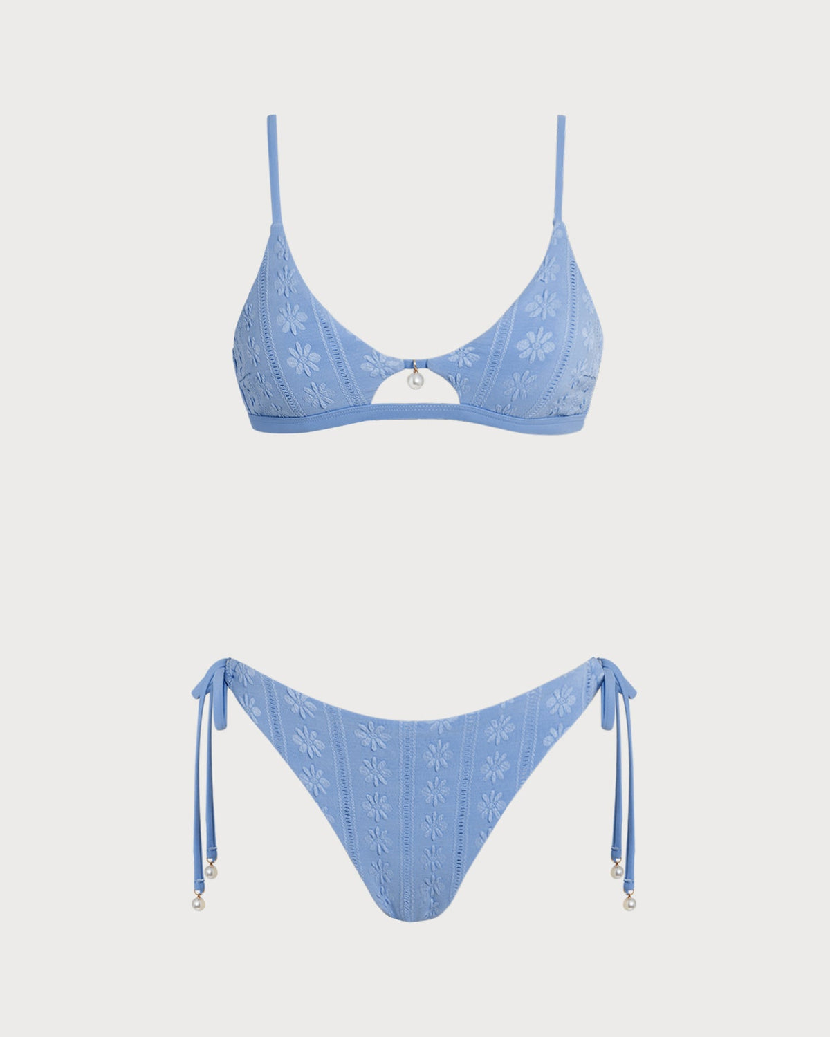 Conjunto de bikini triangular azul con estampado floral y escote en U