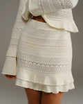 Falda corta de punto beige de talle alto