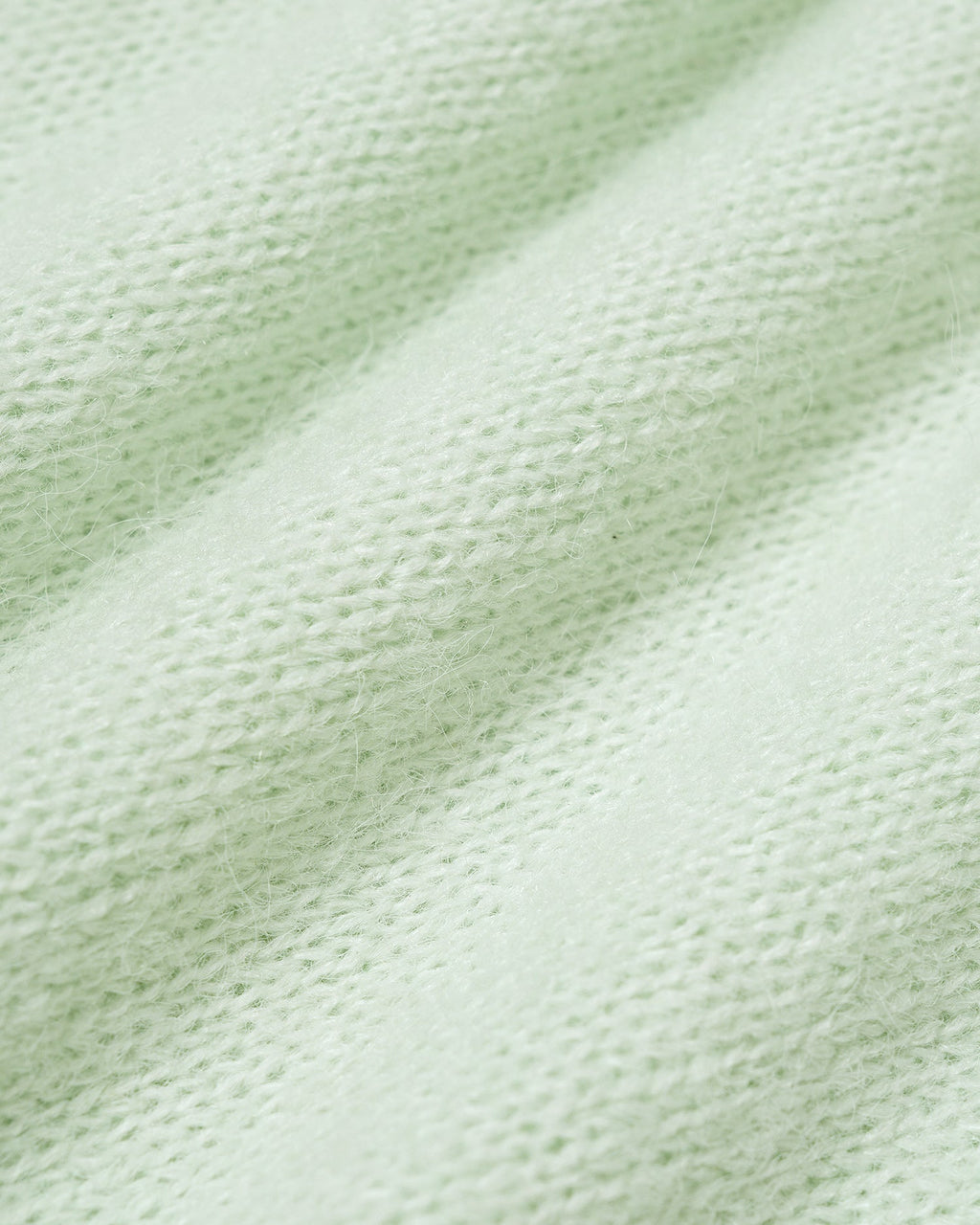 Suéter de punto verde texturizado con cuello redondo