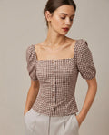 Blusa marrón de cuadros con mangas abullonadas