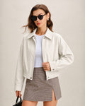 Chaqueta elegante de color blanco roto con bolsillos con cremallera