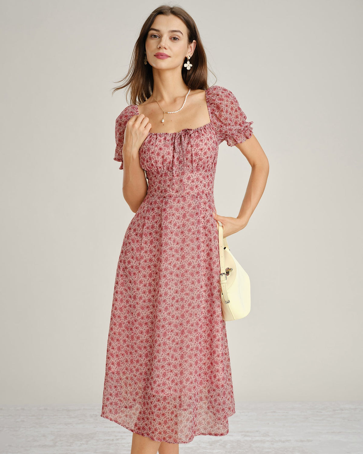 Vestido elegante floral de gasa rosa con escote
