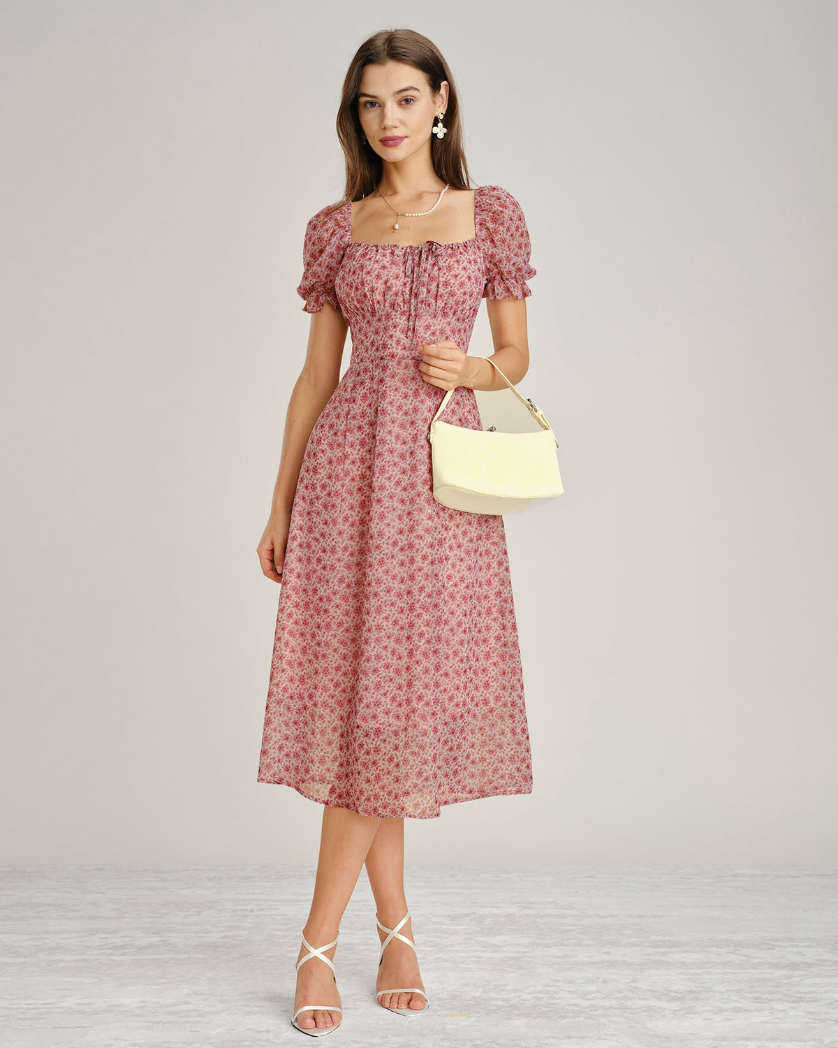 Vestido elegante floral de gasa rosa con escote