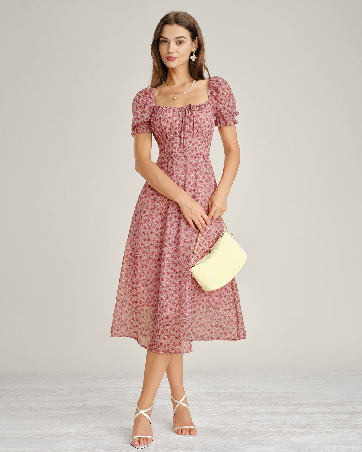 Vestido elegante floral de gasa rosa con escote