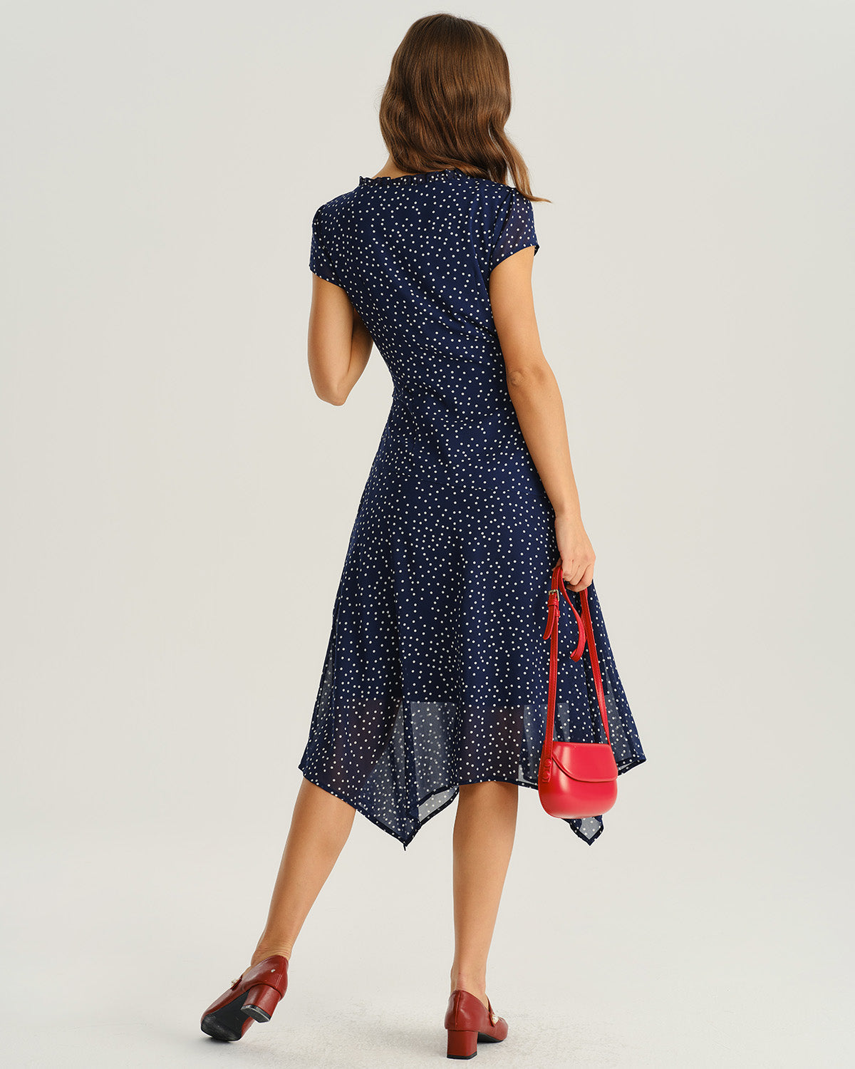Vestido elegante azul marino con lunares