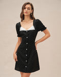 Elegante vestido mini negro de cuello en V con lunares