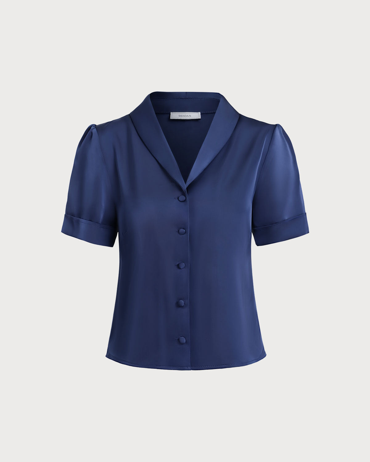 Blusa elegante de satén azul marino con botones