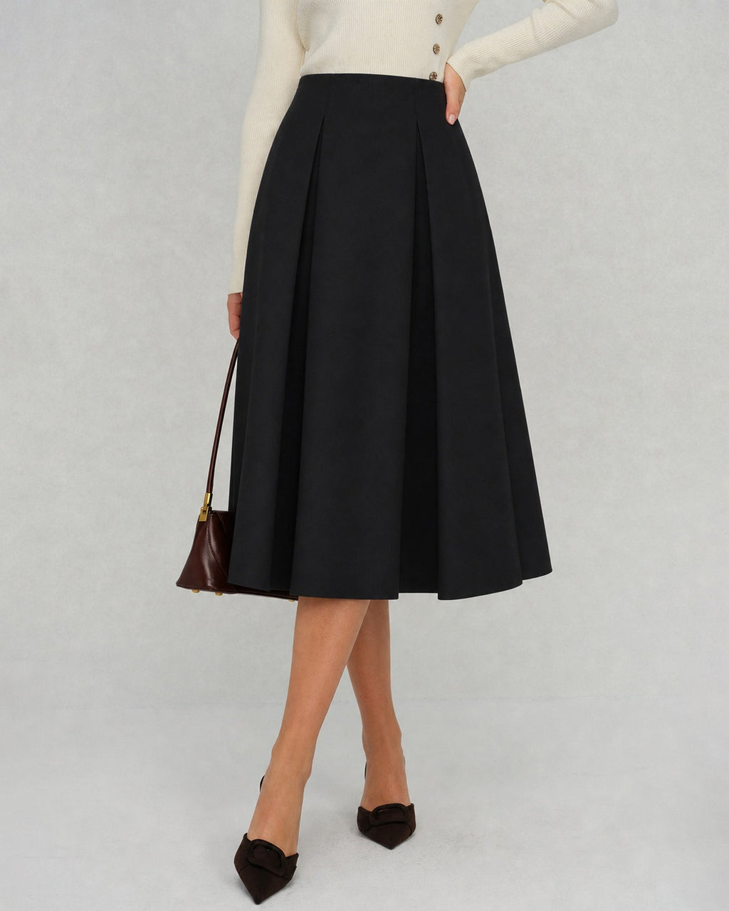 Elegante falda midi negra de corte A con cierre de cremallera